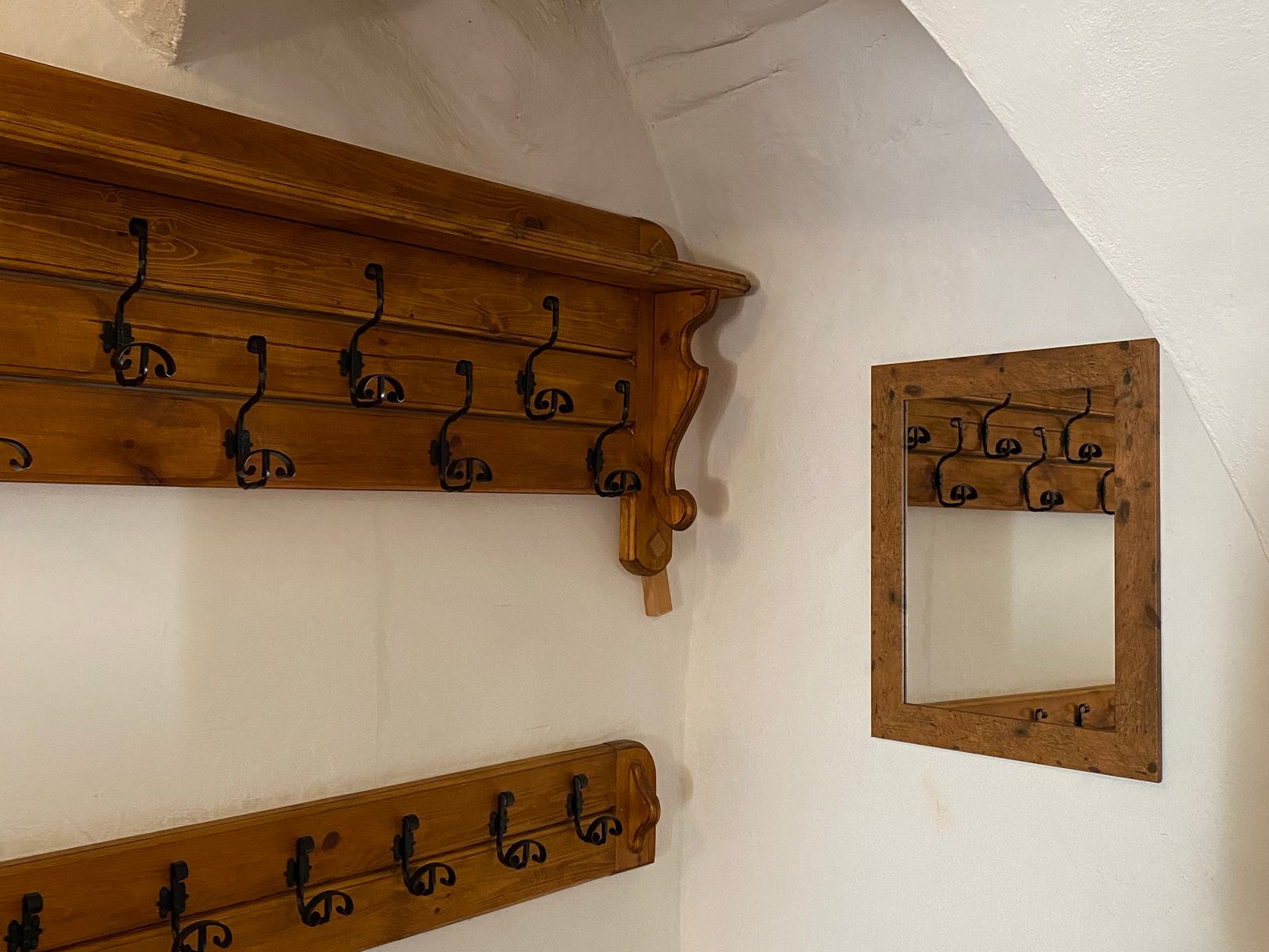 Command strips vs adhesive hooks mounted on a white rental wall