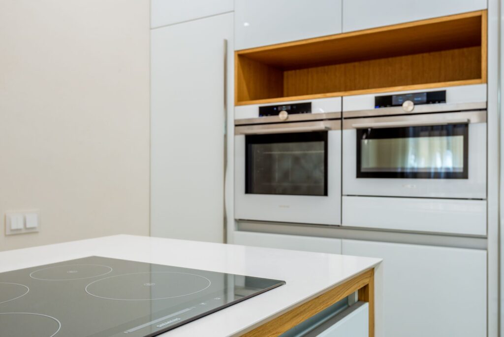 Contemporary rental kitchen with clean built-in oven and cooktop