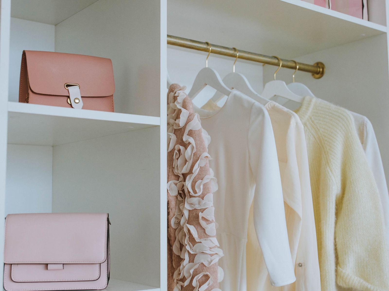 Bins and accessories arranged on rental closet shelves