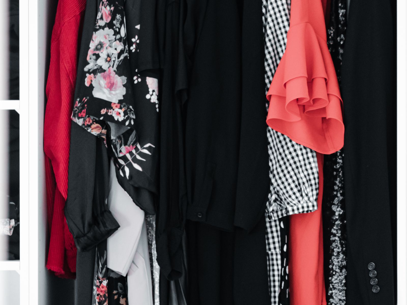 Clothes on matching hangers to organize a rental closet