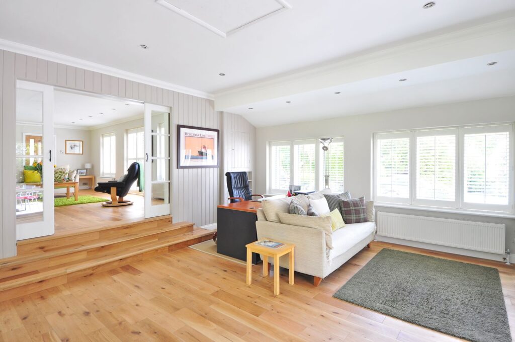 Living room showing how to cover ugly rental floors without replacing them