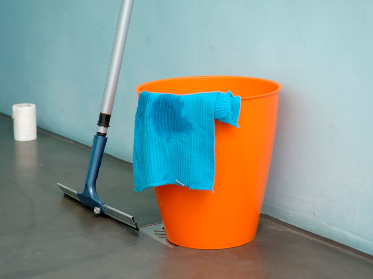 Bucket of cleaning supplies ready for a move-out deep clean