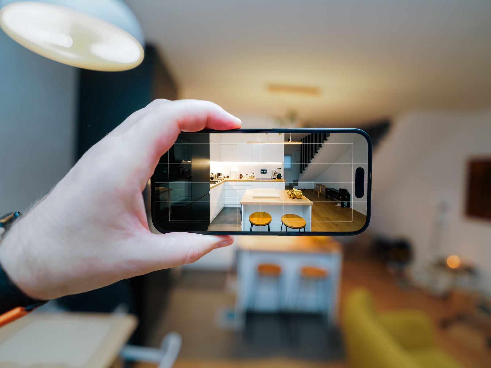 Smartphone photographing an apartment interior to document your rental condition at move-in