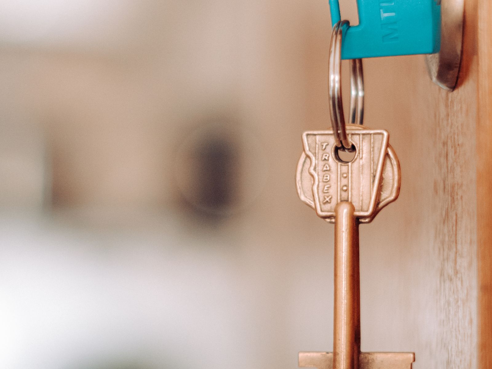 A key in a door lock while returning keys to a landlord at move-out