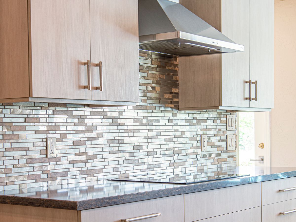 Kitchen cabinets beside ceramic tiles, a common rental kitchen backsplash surface