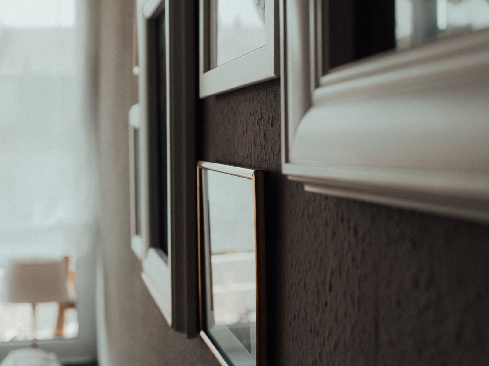 Cozy gallery wall of framed pictures in an apartment