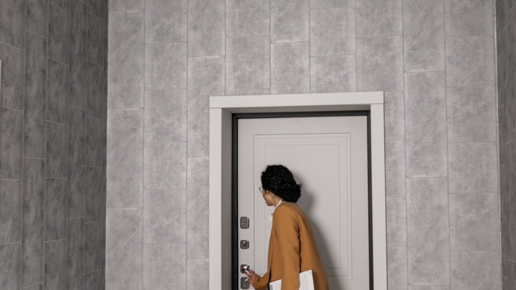 A renter doing a move-in inspection of an empty apartment room