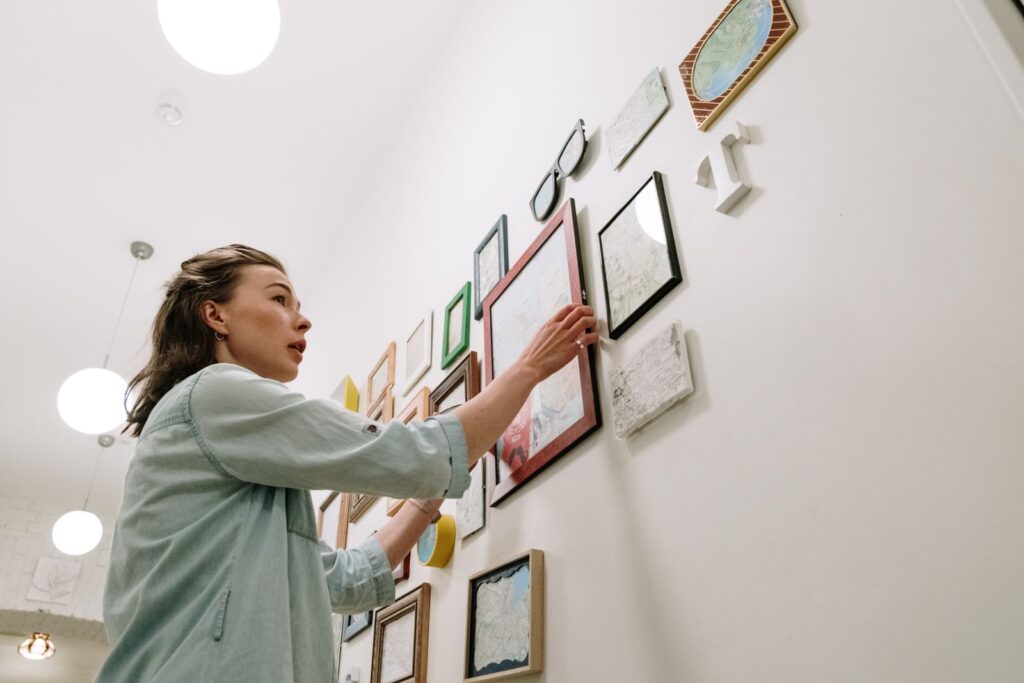How to hang pictures without drilling holes in a rental wall