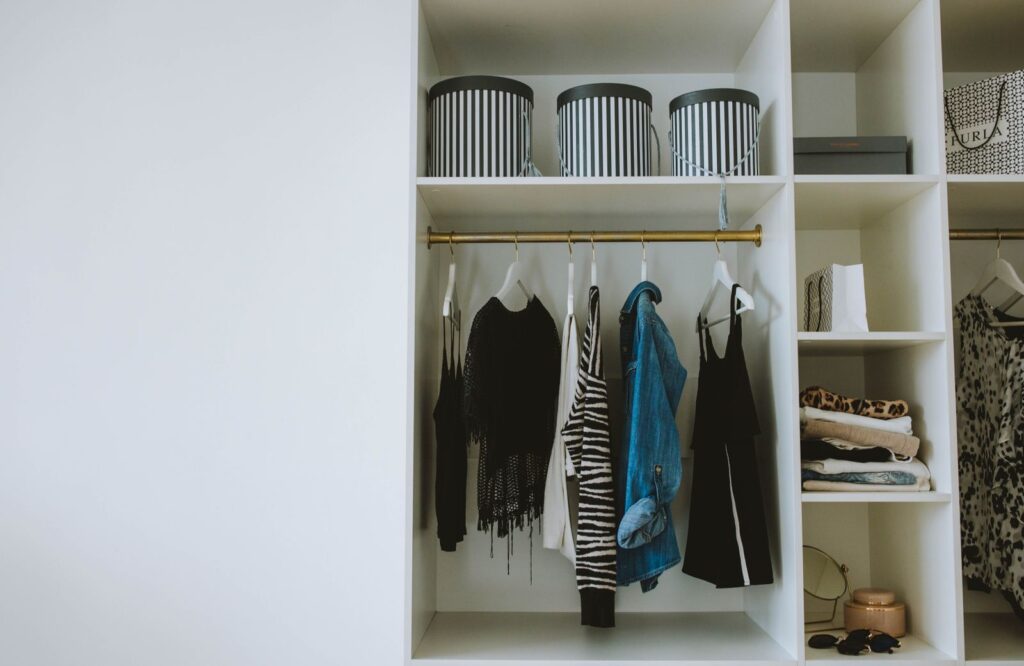 Renter organizing an upgraded closet interior to upgrade closet interiors without permanent changes