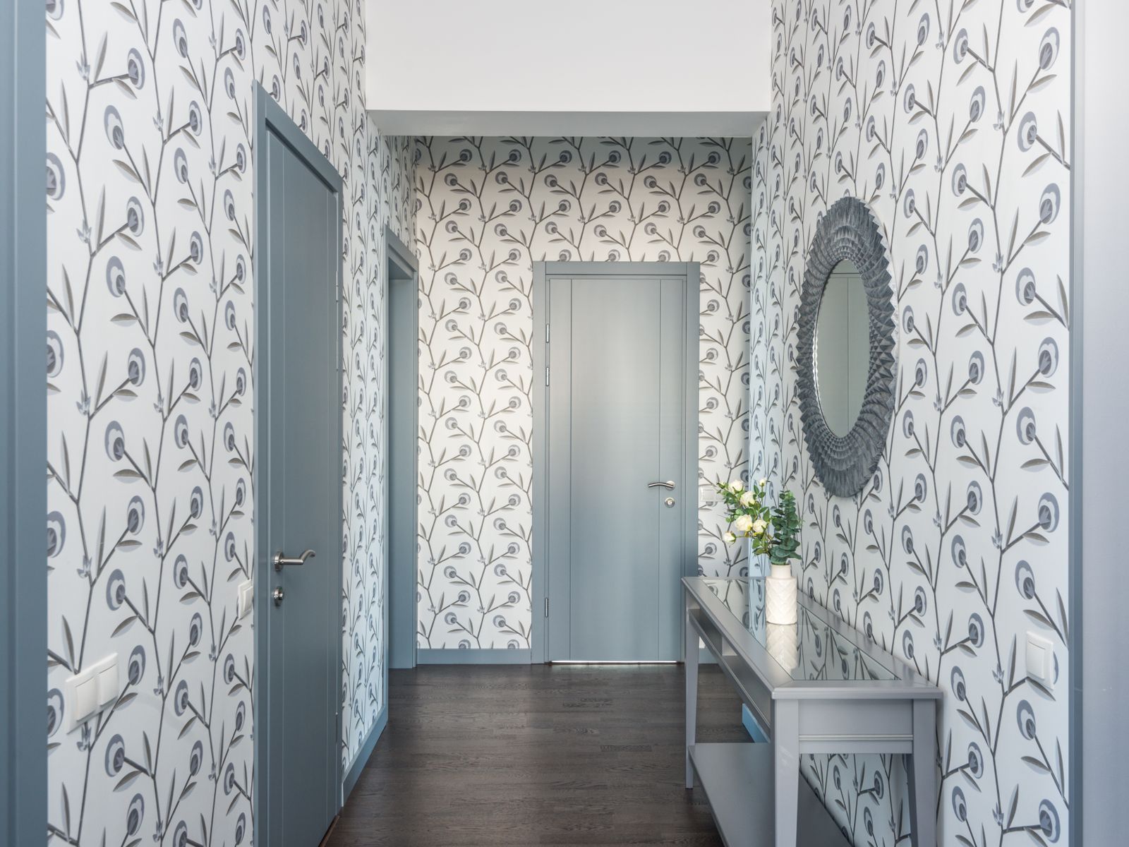 Peel-and-stick wallpaper with a floral pattern on a rental accent wall