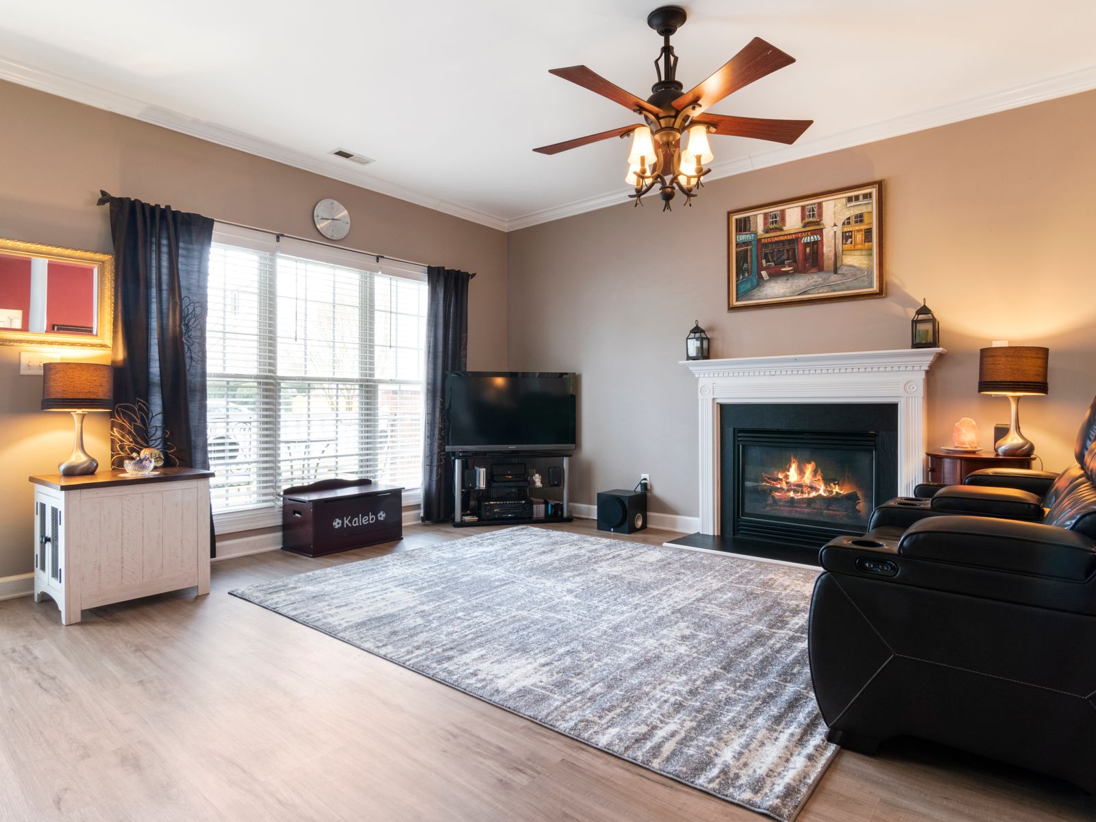 Large area rug used to cover ugly rental floors in a living room
