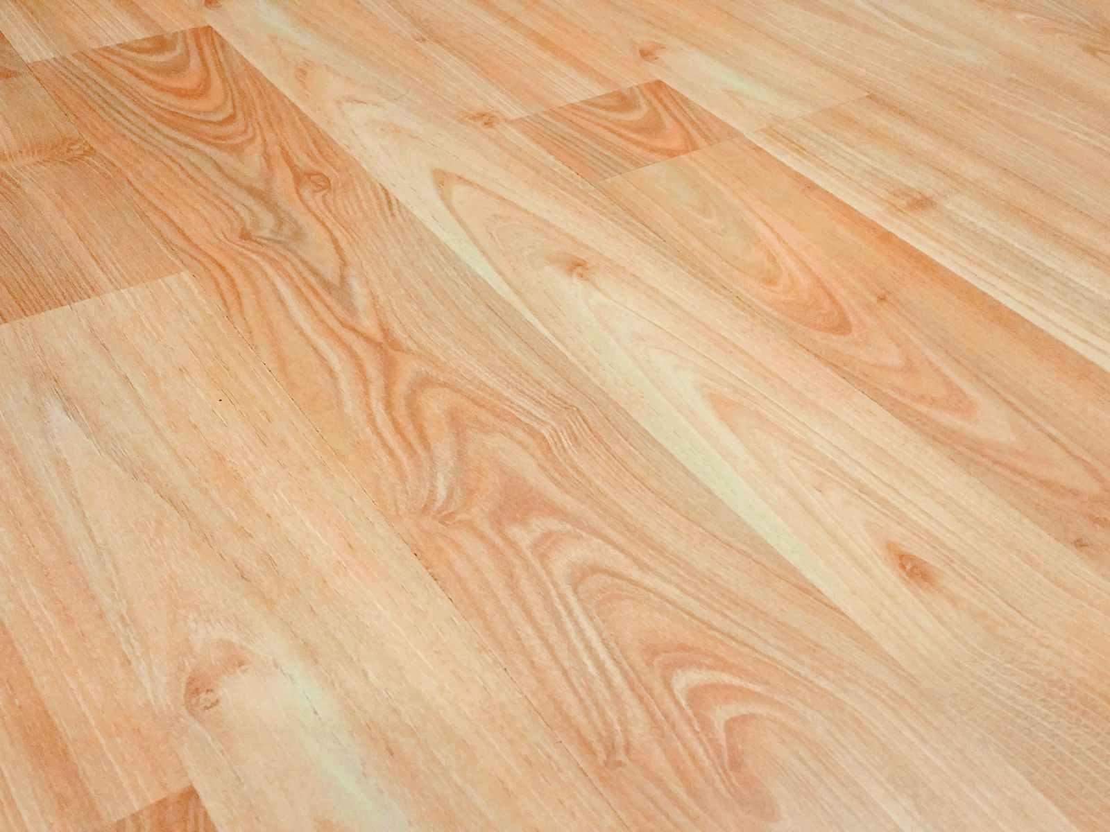 Wood-look vinyl plank flooring laid over an ugly rental floor
