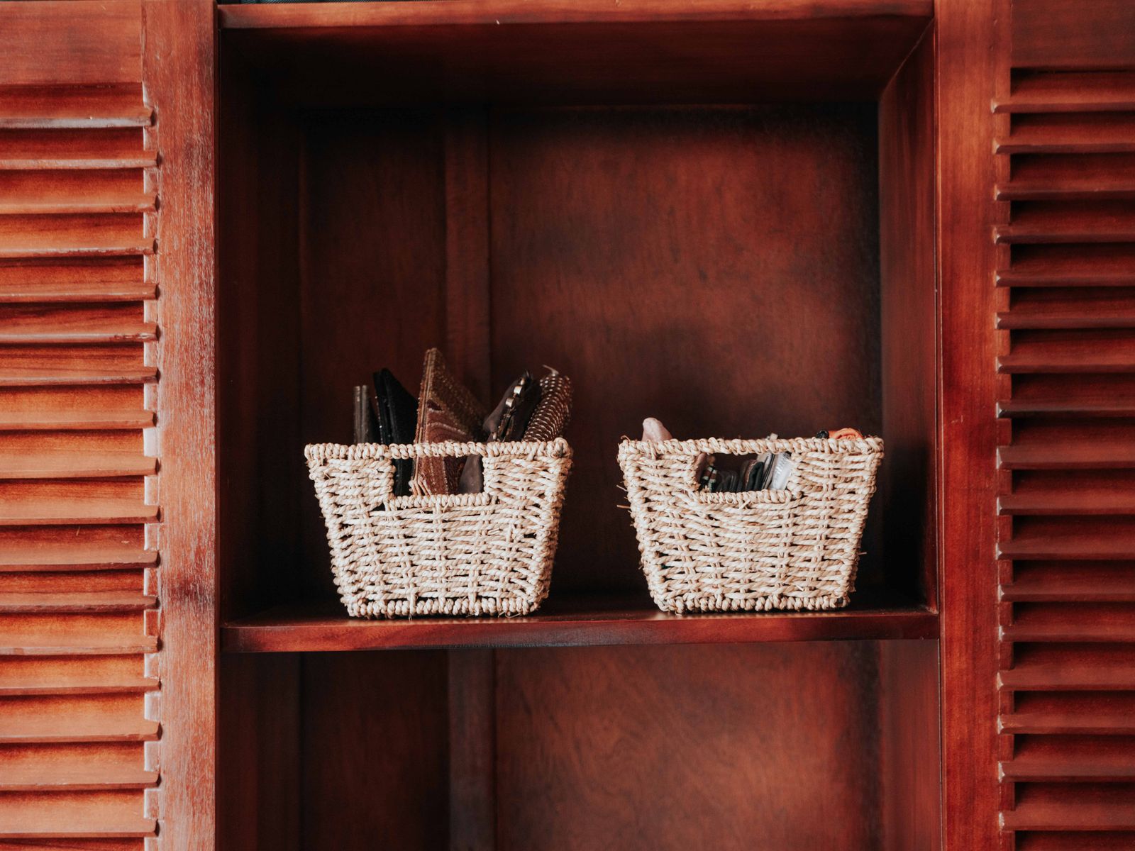 woven storage baskets on a shelf in a rental