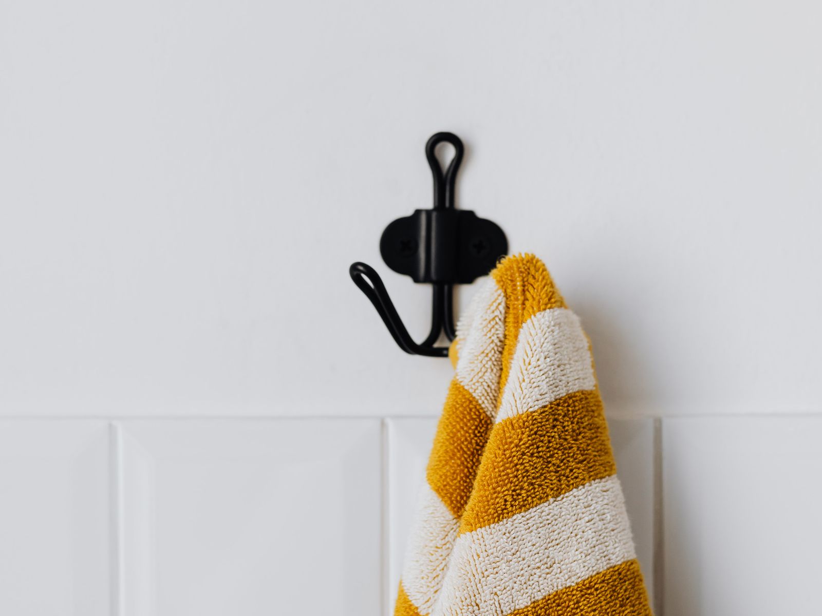A single wall hook holding weight to test its limit