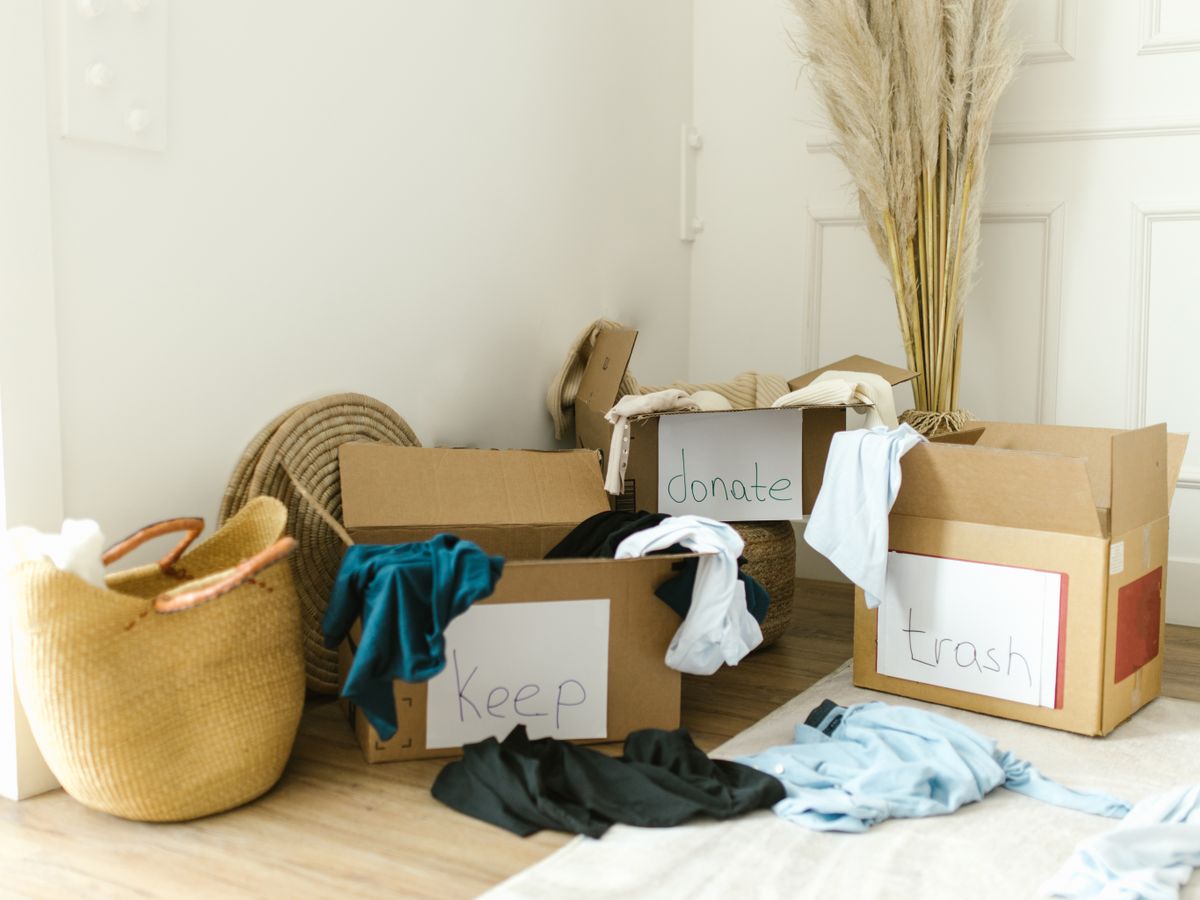 An assortment of household items being sorted into cartons before a move