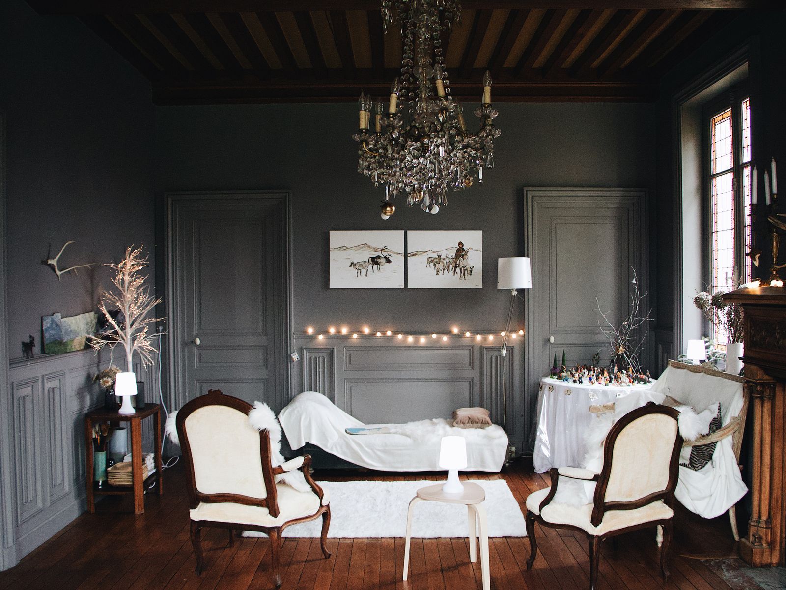 Cozy rental living room lit with warm string lights for a soft ambiance