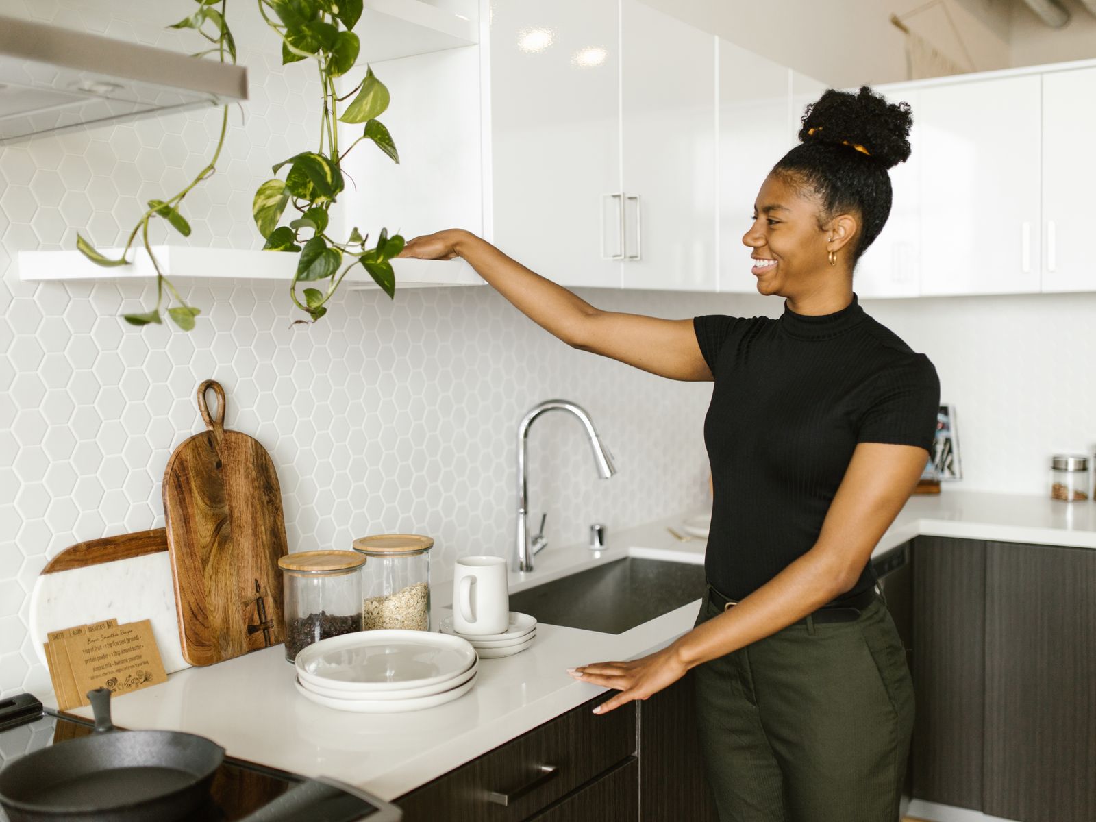 Using tension rods to organize a kitchen cabinet in a rental