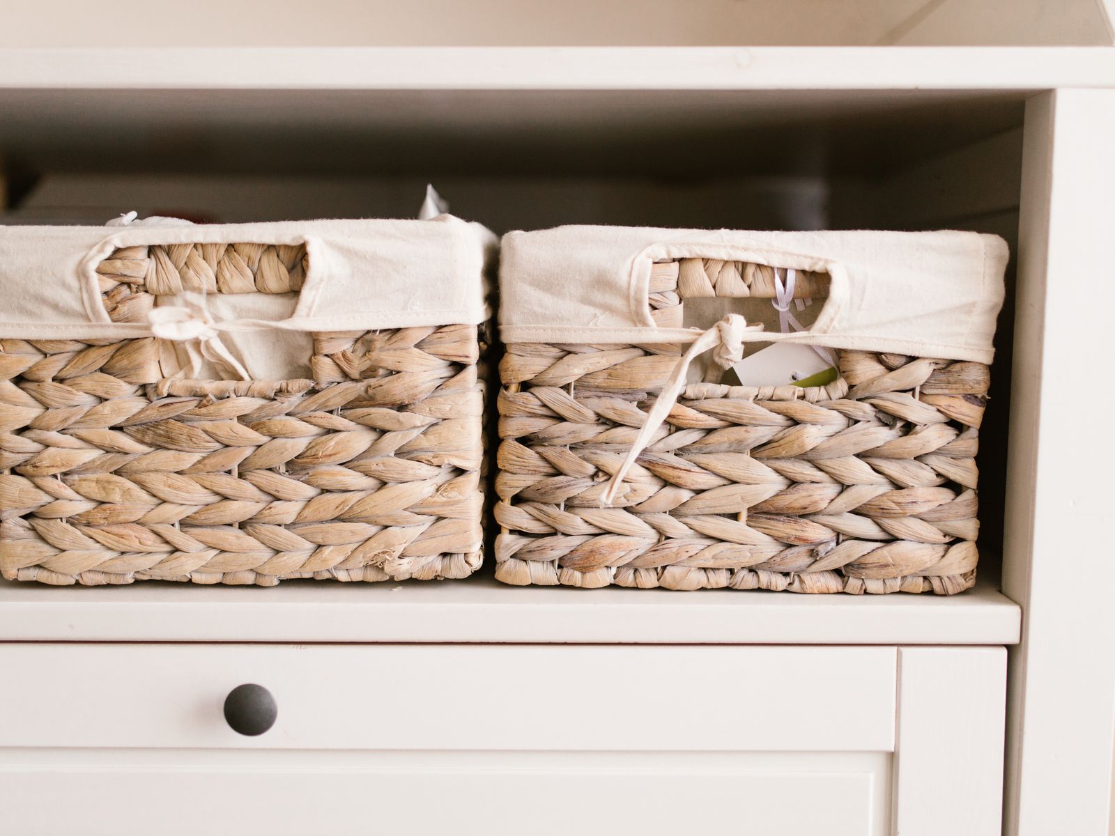 Woven baskets neatly arranged to organize bathroom supplies